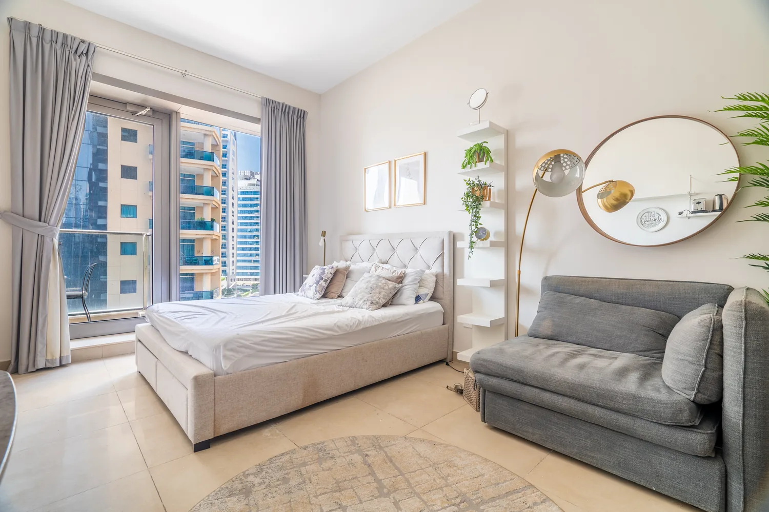 The same Dubai Marina studio before redesign — cool grey scheme